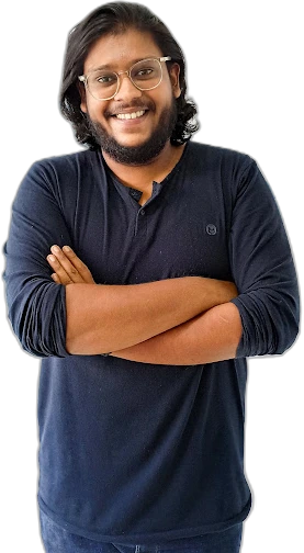 Vishnu Balan, arms crossed, smiling